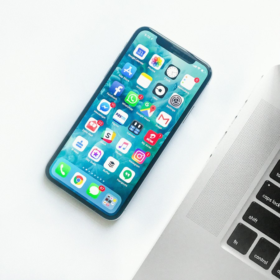 Smartphone held above a pale surface